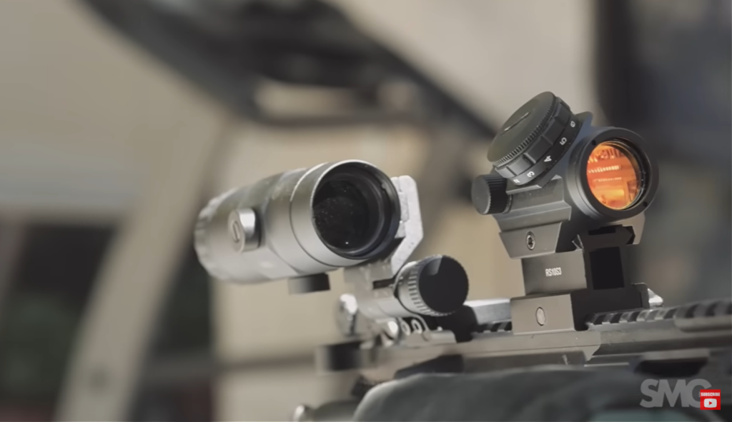 The magnifier eotech xps2 on the weapon - close-up view and blurred background behind it