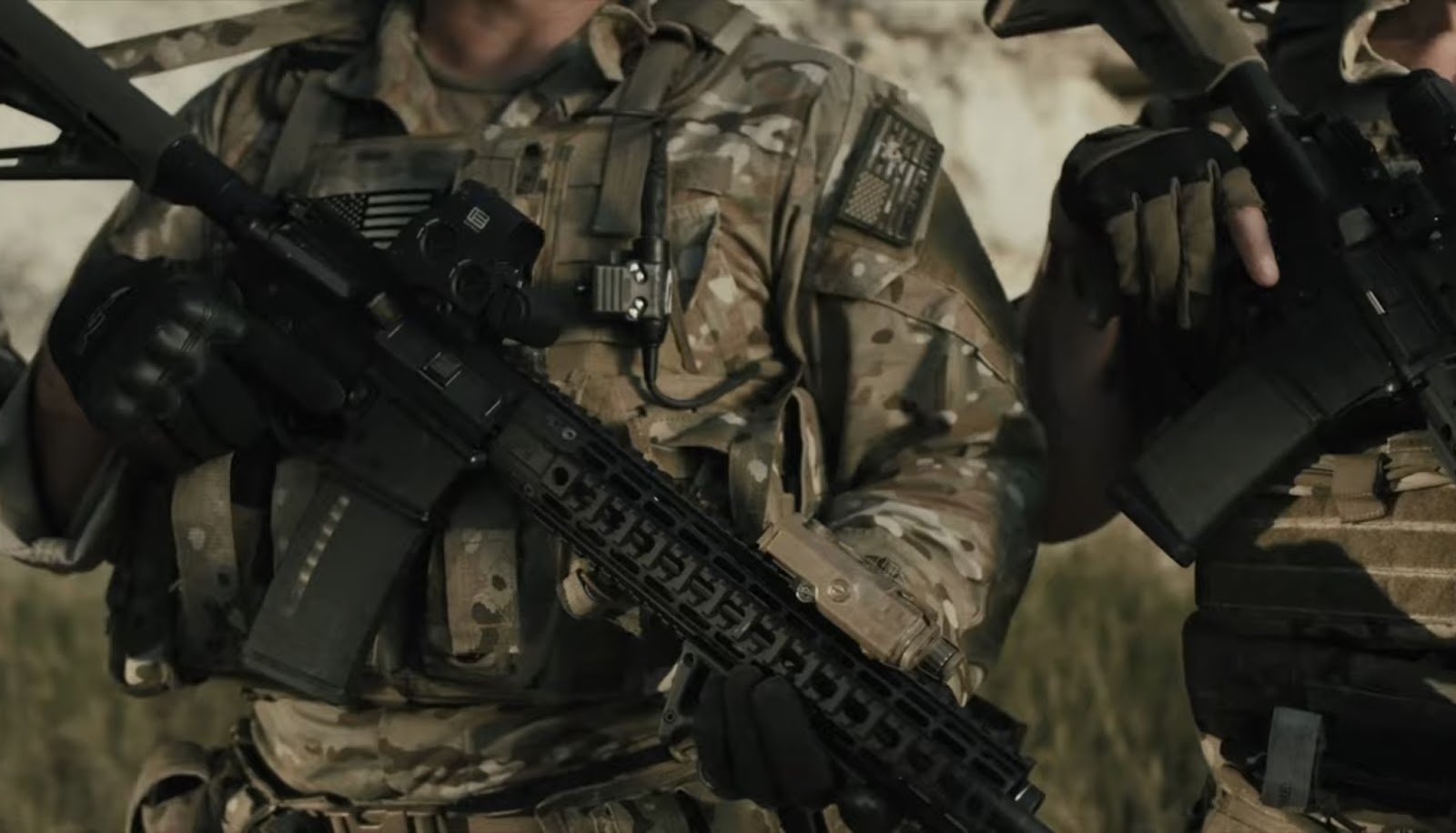 military man holds a weapon