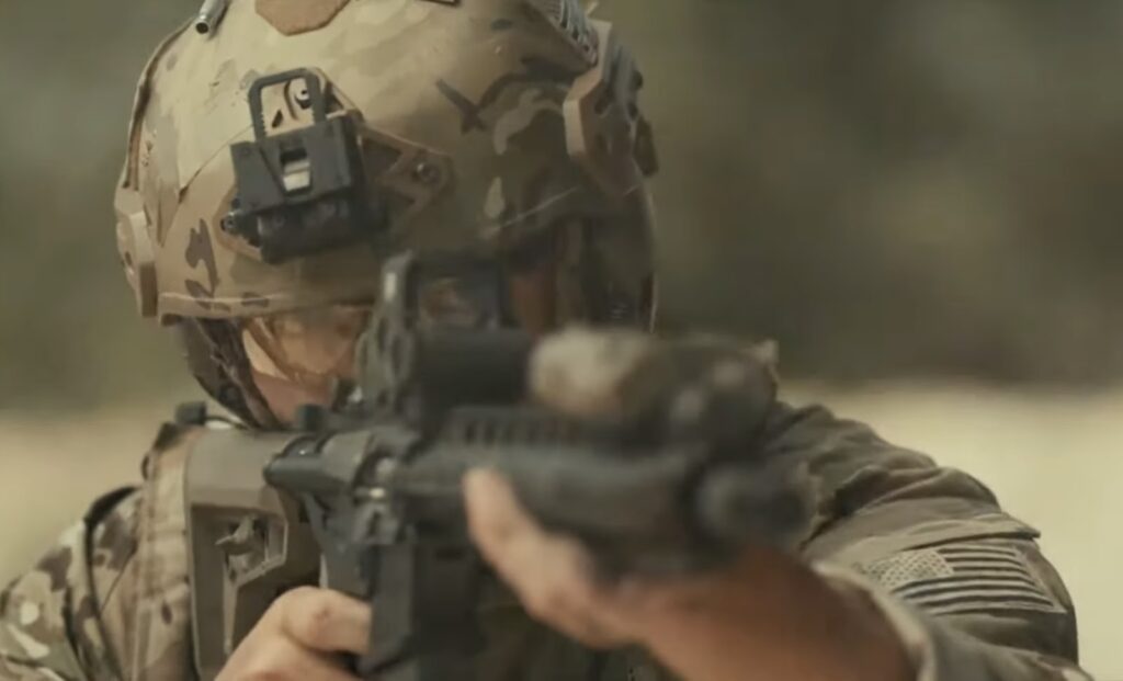 military man shoots a weapon
