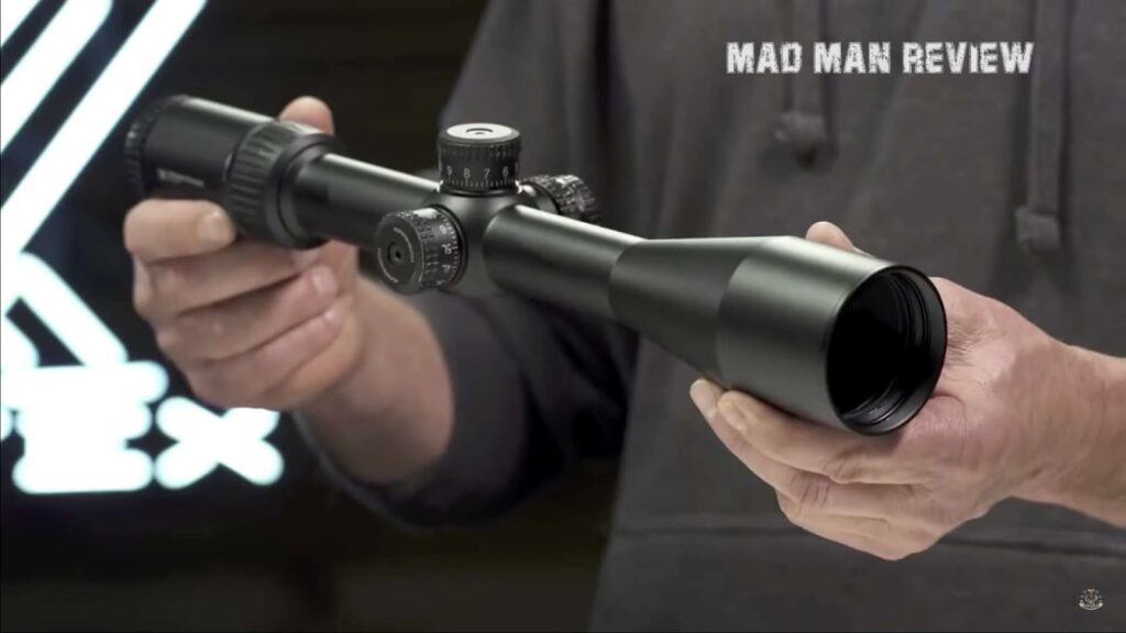 Man holding long distance scope