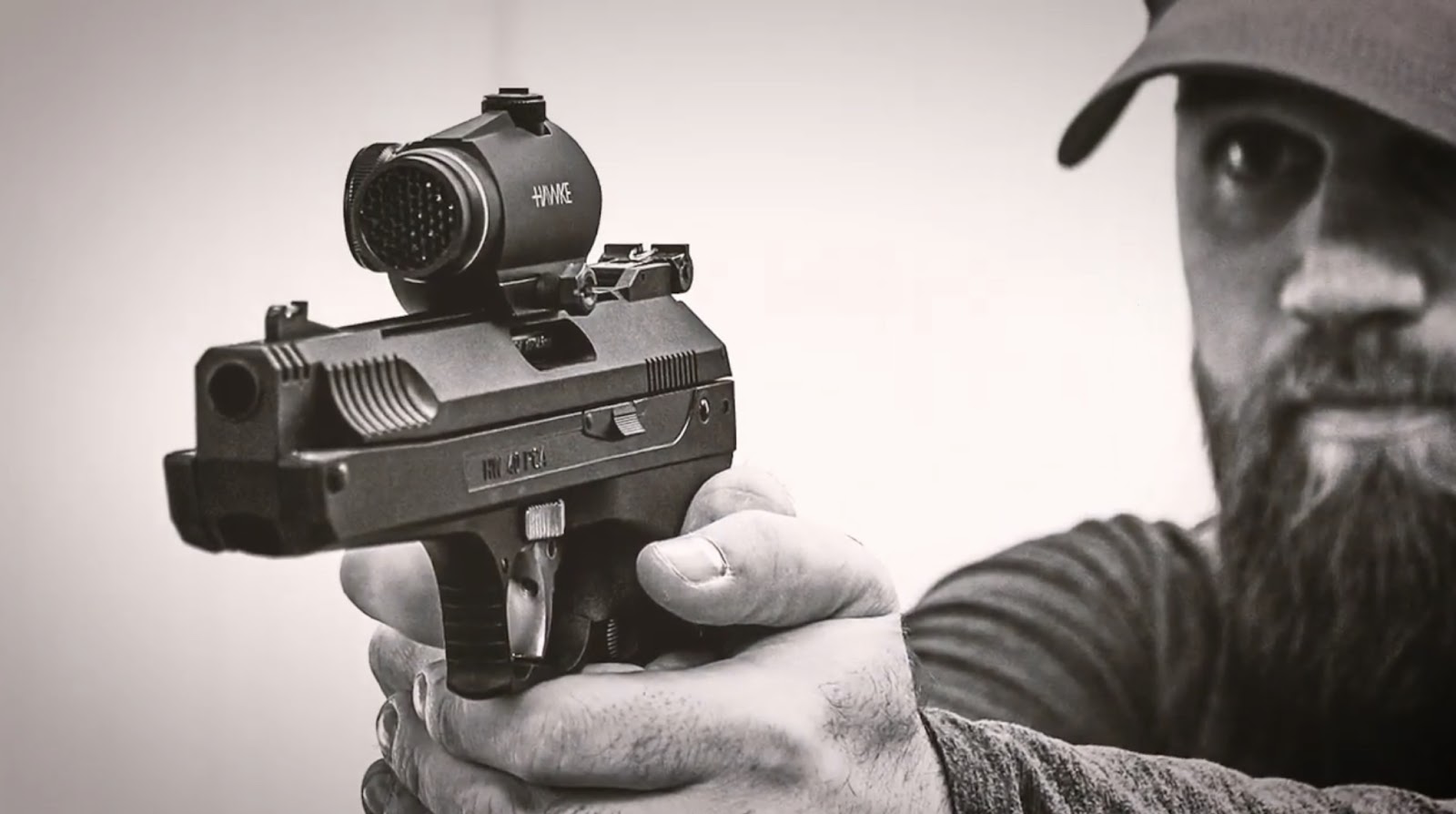 man shoots a gun