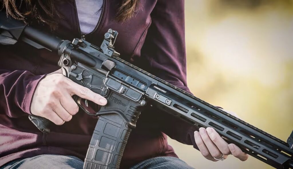 Woman holding gun