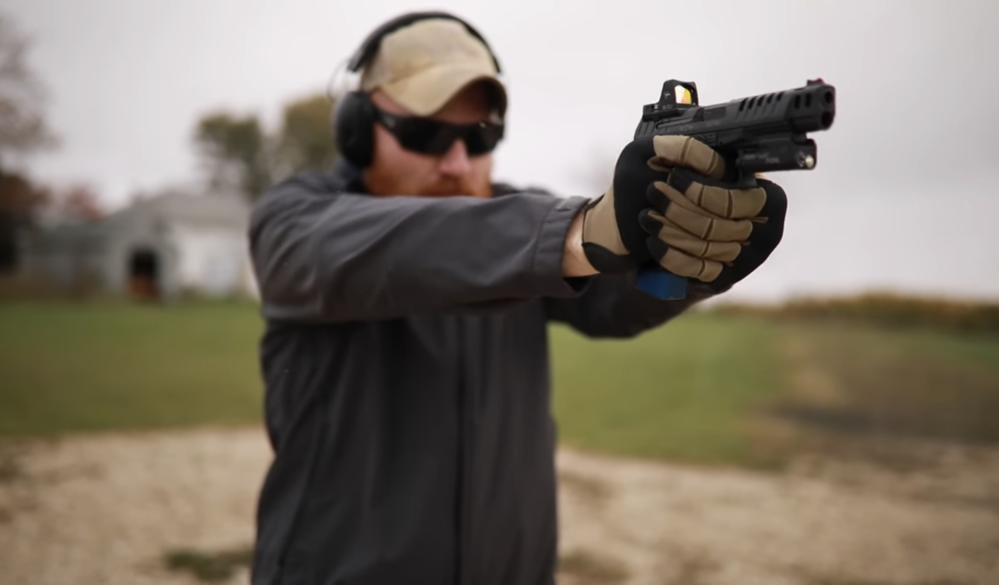 man holding the gun.